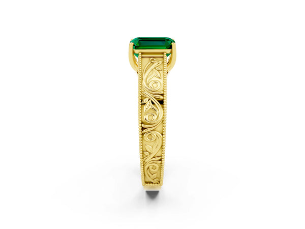 Yellow gold Emerald Cut Emerald Solitaire Ring with Engraved Band and Four-Prong Setting