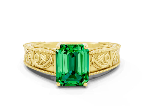 Yellow gold Emerald Cut Emerald Solitaire Ring with Engraved Band and Four-Prong Setting