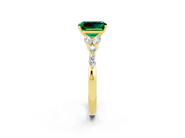 Yellow gold Emerald Cut Emerald Solitaire Ring with Side Stones and Four-Prong Setting