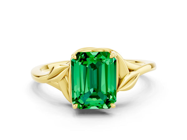 Yellow gold Emerald Cut Emerald Solitaire Ring with Twist Band and Four-Prong Setting