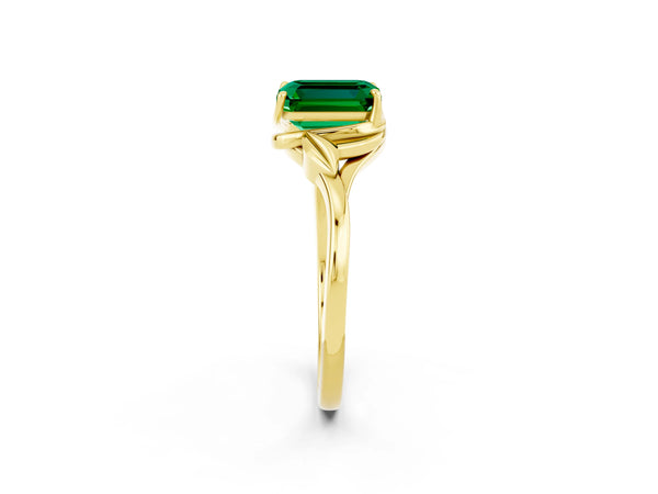 Yellow gold Emerald Cut Emerald Solitaire Ring with Twist Band and Four-Prong Setting