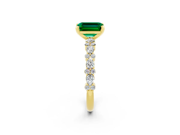 Yellow gold Emerald Cut Emerald Side Stone Solitaire Ring with Round  and Four-Prong Setting