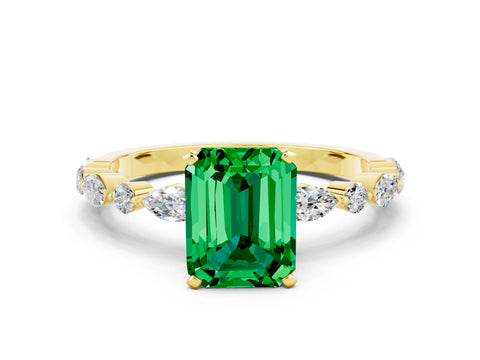 Yellow gold Emerald Cut Emerald Solitaire with Side Stones on a Pavé Band and Four-Prong Setting