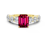 Yellow gold Emerald Cut Garnet Prong Setting with Side Stones on a Pave Band
