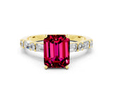 Yellow gold Emerald Cut Garnet Solitaire with Side Baguettes and Channel Set Band