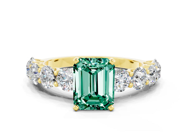 Yellow gold Emerald Cut Green Sapphire Prong Setting with Side Stones on a Pave Band