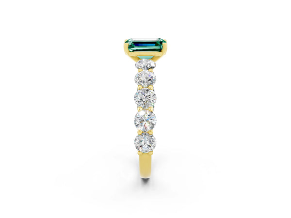 Yellow gold Emerald Cut Green Sapphire Prong Setting with Side Stones on a Pave Band