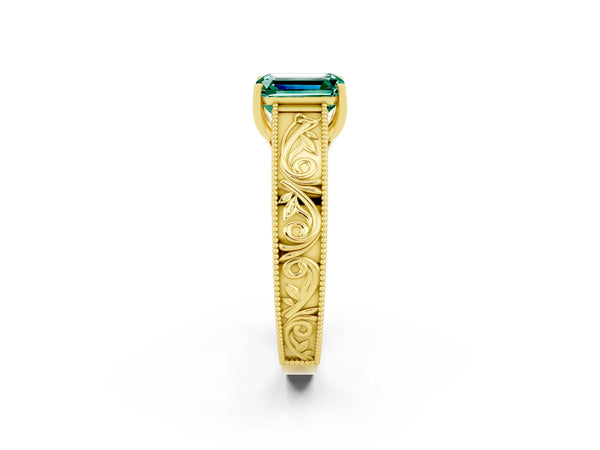 Yellow gold Emerald Cut Green Sapphire Solitaire Ring with Engraved Band and Four-Prong Setting