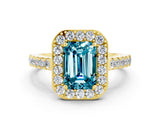Yellow gold Emerald Cut Halo Diamond Ring with Pavé Band and Three-Prong Setting