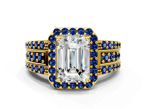 Yellow gold Emerald Cut Halo Diamond Ring with Round with Blue Sapphire side stone Split Shank and Prong Setting