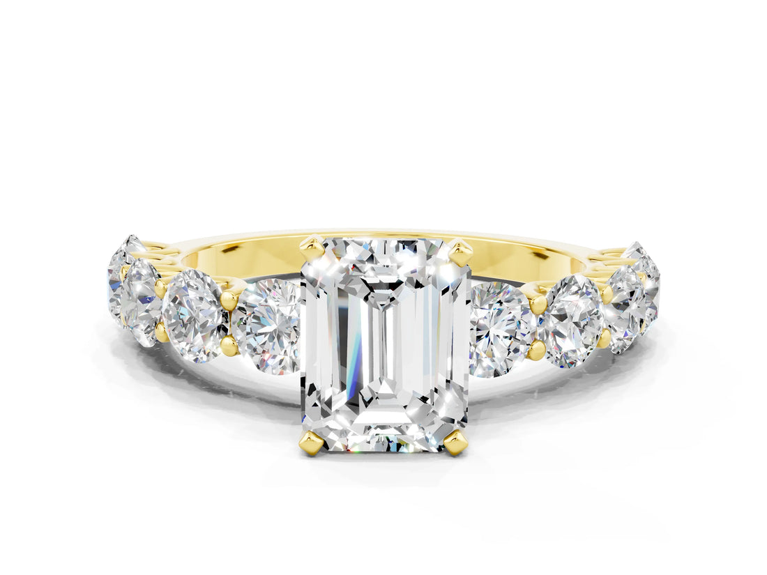 Yellow gold Emerald Cut Moissanite Prong Setting with Side Stones on a Pave Band