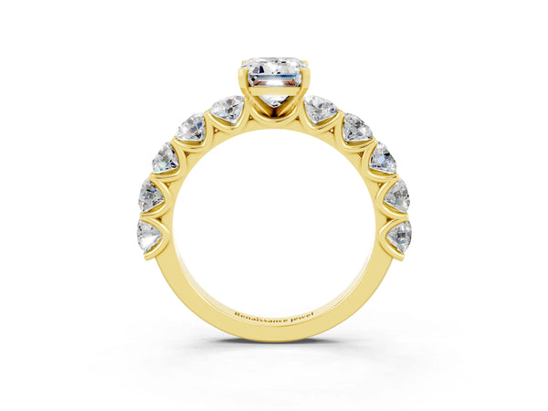 Yellow gold Emerald Cut Moissanite Prong Setting with Side Stones on a Pave Band