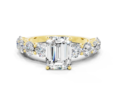 Yellow gold Emerald Cut Moissanite Prong Setting with Side Stones on a Pave Band