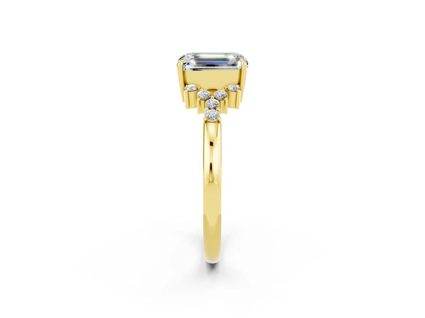Yellow gold Emerald Cut Moissanite Ring with Side Stones and Four-Prong Setting