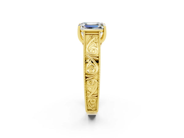 Yellow gold Emerald Cut Moissanite Solitaire Ring with Engraved Band and Four-Prong Setting