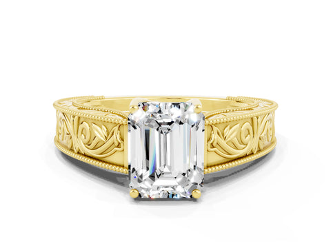 Yellow gold Emerald Cut Moissanite Solitaire Ring with Engraved Band and Four-Prong Setting