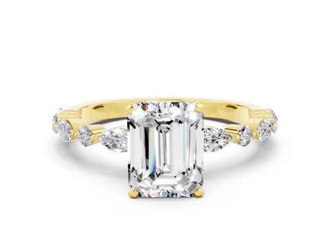 Yellow gold Emerald Cut Moissanite Solitaire with Side Stones on a Pavé Band and Four-Prong Setting