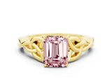 Yellow gold Emerald Cut Morganite Solitaire Engagement Ring with Celtic Knot Band and Four-Prong Setting