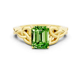 Yellow gold Emerald Cut Peridot Solitaire Engagement Ring with Celtic Knot Band and Four-Prong Setting