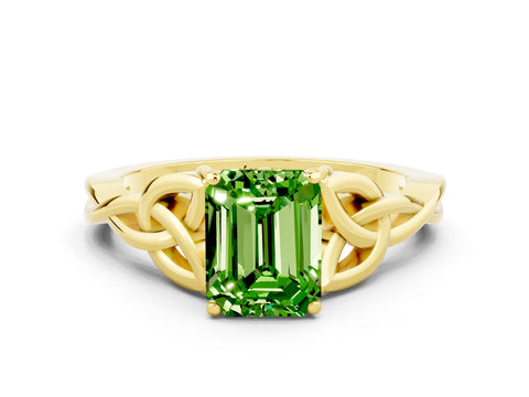 Yellow gold Emerald Cut Peridot Solitaire Engagement Ring with Celtic Knot Band and Four-Prong Setting