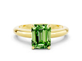 Yellow gold Emerald Cut Peridot Solitaire Engagement Ring with Round Band and Four-Prong Setting