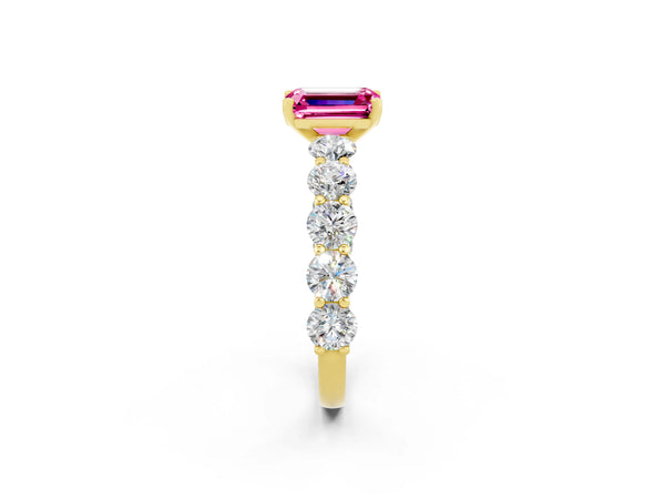 Yellow gold Emerald Cut Pink Sapphire Prong Setting with Side Stones on a Pave Band