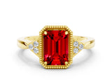 Yellow gold Emerald Cut Ruby Halo Ring with Tapered Band and Four-Prong Setting