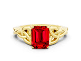Yellow gold Emerald Cut Ruby Solitaire Engagement Ring with Celtic Knot Band and Four-Prong Setting