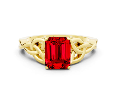 Yellow gold Emerald Cut Ruby Solitaire Engagement Ring with Celtic Knot Band and Four-Prong Setting