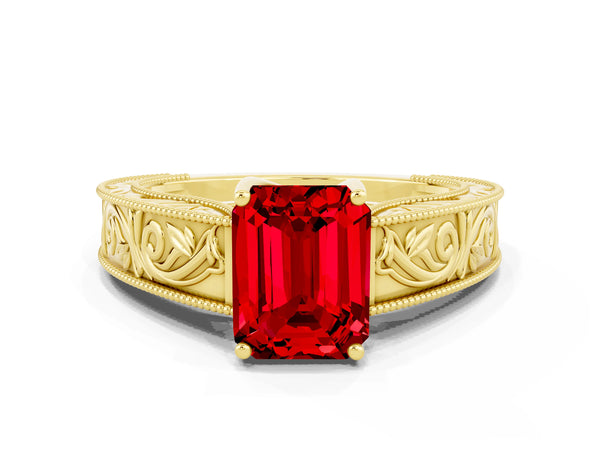 Yellow gold Emerald Cut Ruby Solitaire Ring with Engraved Band and Four-Prong Setting