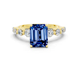 Yellow gold Emerald Cut Solitaire Blue Sapphire Ring with Pave Band and Four-Prong Setting