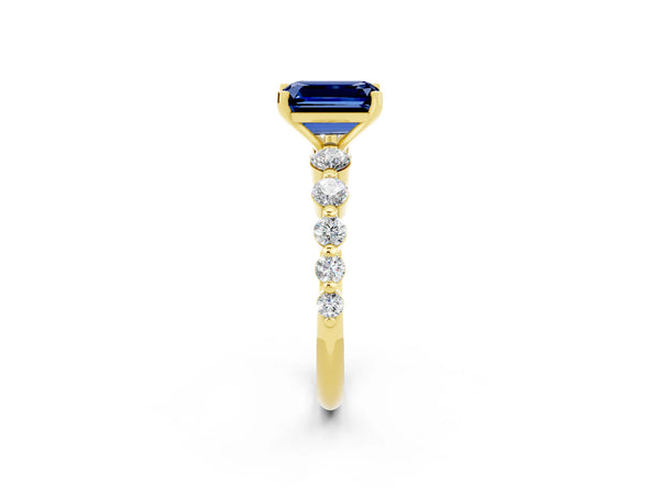 Yellow gold Emerald Cut Solitaire Blue Sapphire Ring with Pave Band and Four-Prong Setting