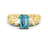 Yellow gold Emerald Cut Solitaire Blue Topaz Leaf-Inspired Vine Band Ring with Prong Setting