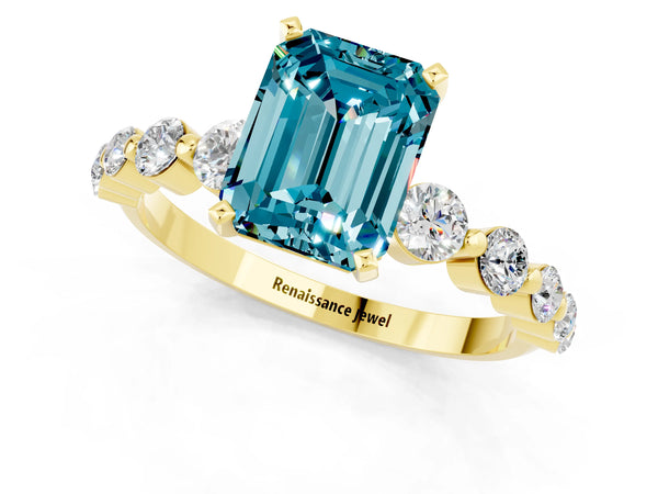 Yellow gold Emerald Cut Solitaire Blue Topaz Ring with Pave Band and Four-Prong Setting