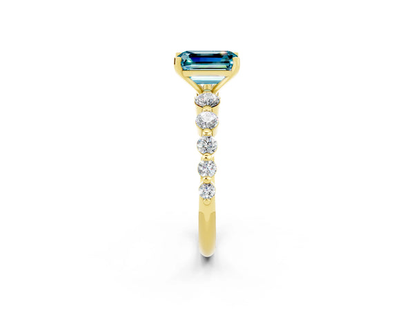 Yellow gold Emerald Cut Solitaire Blue Topaz Ring with Pave Band and Four-Prong Setting