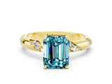 Yellow gold Emerald Cut Solitaire Diamond Engagement Ring with Twisted Pave Band and Four-Prong Setting
