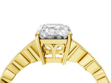 Yellow gold Emerald Cut Solitaire Diamond Ring with Infinity Twist Band and Four-Prong Setting_13