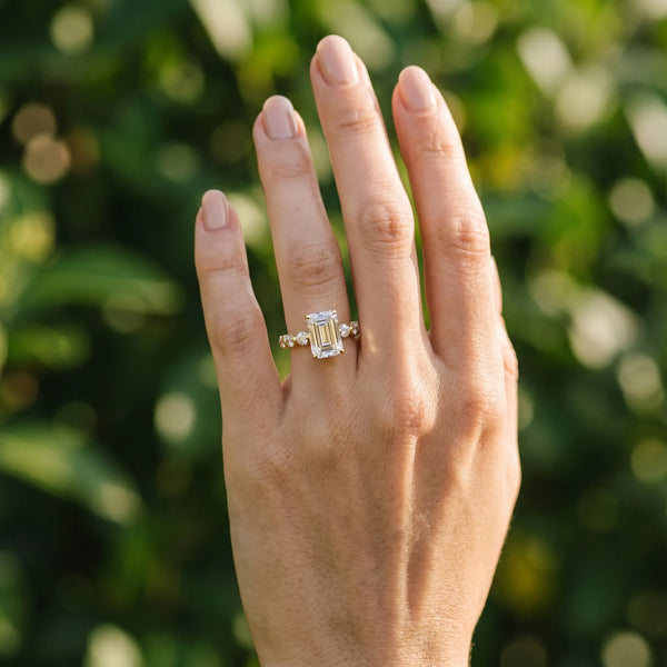 Yellow gold Emerald Cut Solitaire Diamond Ring with Pave Band and Four-Prong Setting