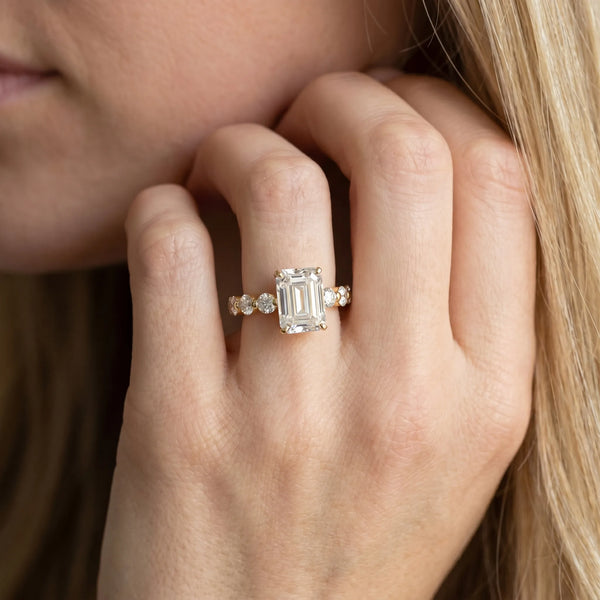 Yellow gold Emerald Cut Solitaire Diamond Ring with Pave Band and Four-Prong Setting