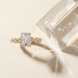 Yellow gold Emerald Cut Solitaire Diamond Ring with Pave Band and Four-Prong Setting_15