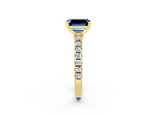 Yellow gold Emerald Cut Solitaire Blue Sapphire with Pavé Band and Four-Prong Setting