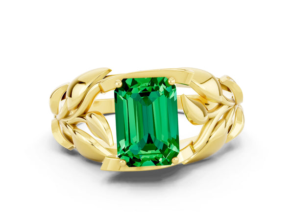 Yellow gold Emerald Cut Emerald Leaf-Inspired Engagement Ring with Round Accents and Prong Setting