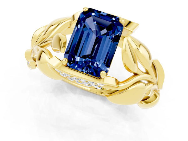 Yellow gold Emerald Cut Blue Sapphire Leaf-Inspired Engagement Ring with Round Accents and Prong Setting