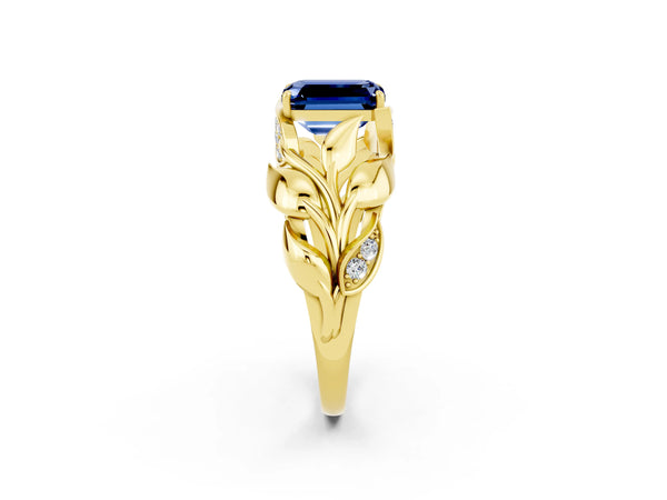 Yellow gold Emerald Cut Blue Sapphire Leaf-Inspired Engagement Ring with Round Accents and Prong Setting