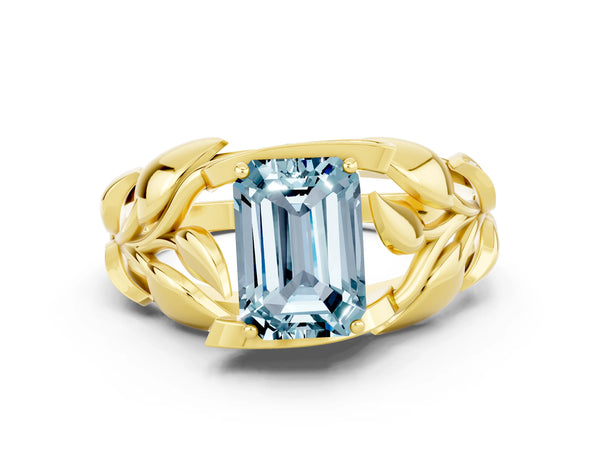 Yellow gold Emerald Cut Aquamarine Leaf-Inspired Engagement Ring with Round Accents and Prong Setting