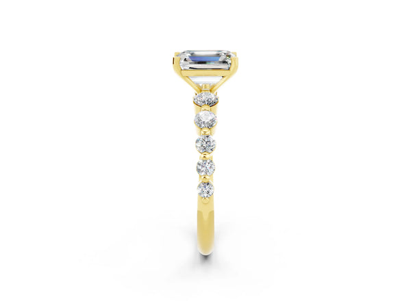 Yellow gold Emerald Cut Solitaire Moissanite Ring with Pave Band and Four-Prong Setting