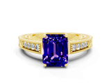 Yellow gold Emerald Cut Tanzanite Engagement Ring with Milgrain Channel Set Band and Prong Setting