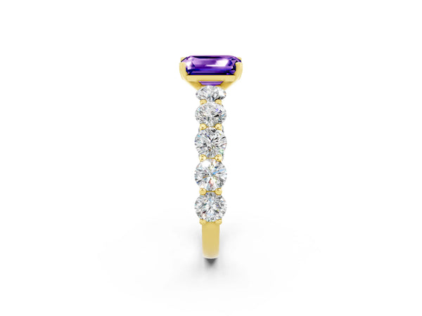 Yellow gold Emerald Cut Tanzanite Prong Setting with Side Stones on a Pave Band