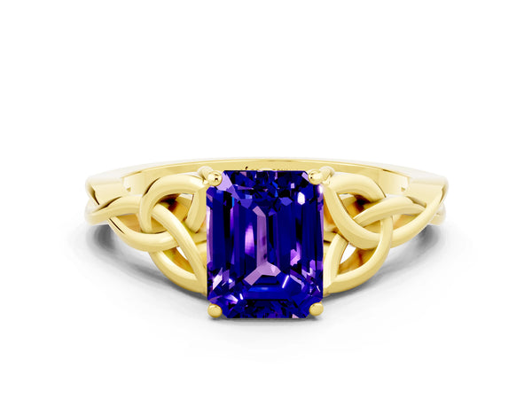 Yellow gold Emerald Cut Tanzanite Solitaire Celtic Knot Ring with Four-Prong Setting