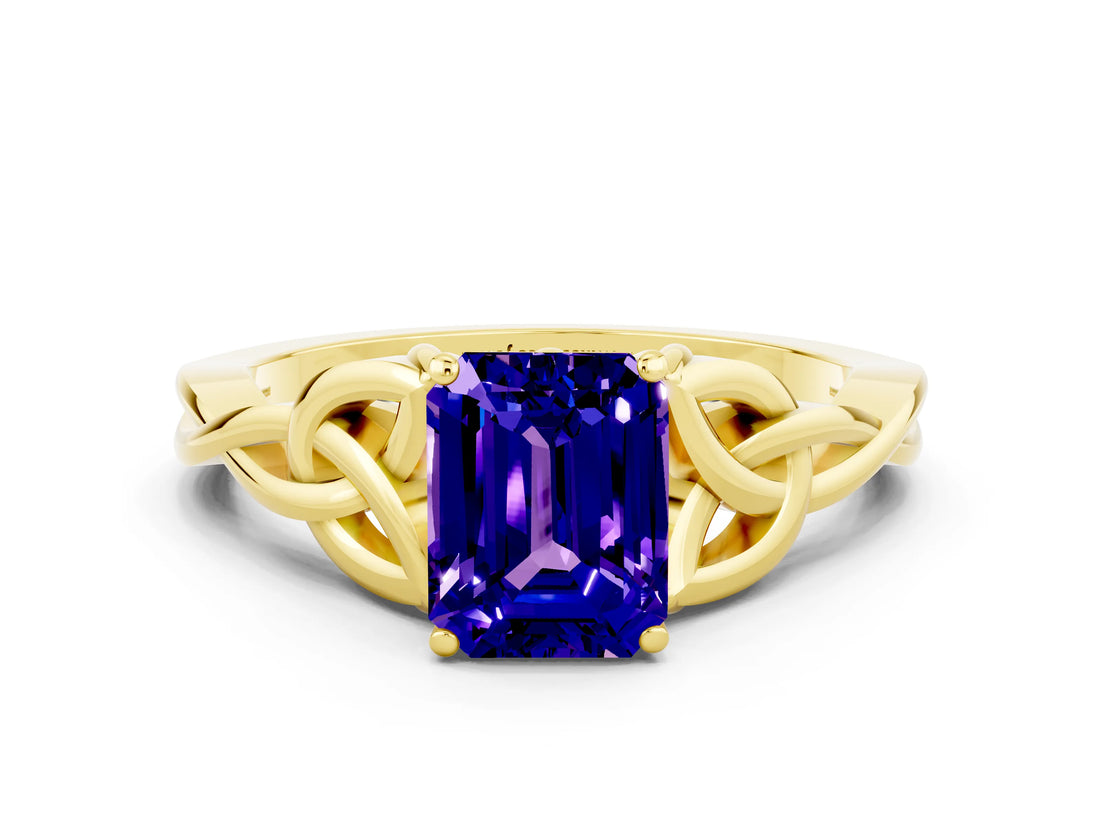 Yellow gold Emerald Cut Tanzanite Solitaire Engagement Ring with Celtic Knot Band and Four-Prong Setting